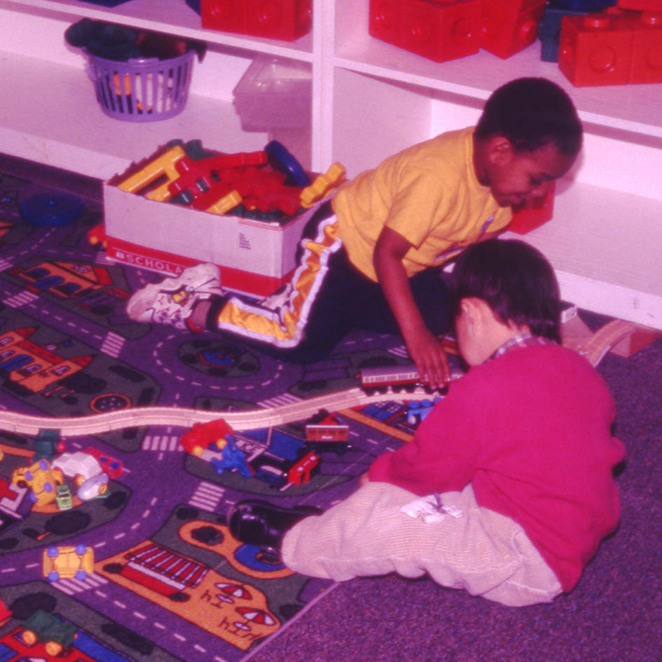 Children playing on a floor mat