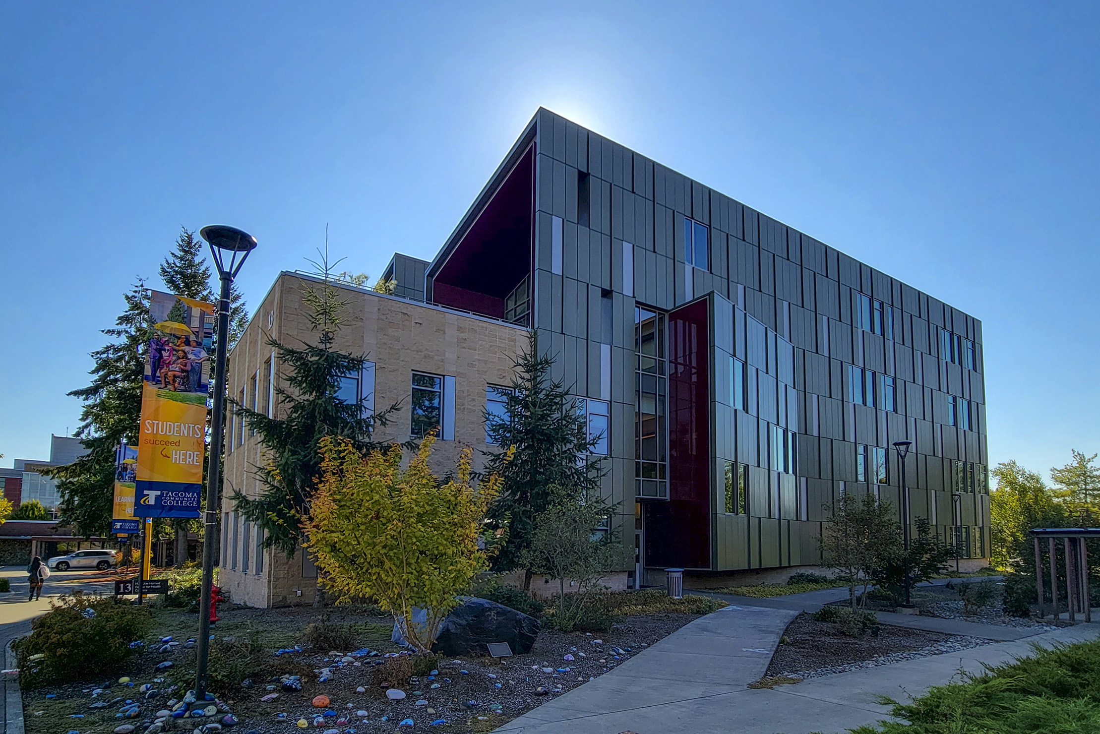 Backlit exterior view of the Harned Center