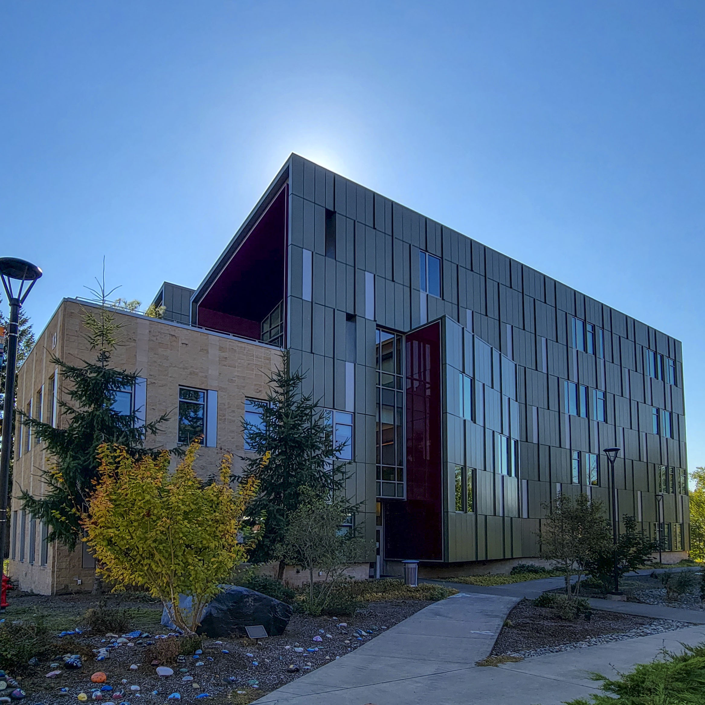 Backlit view of the Harned Center building 