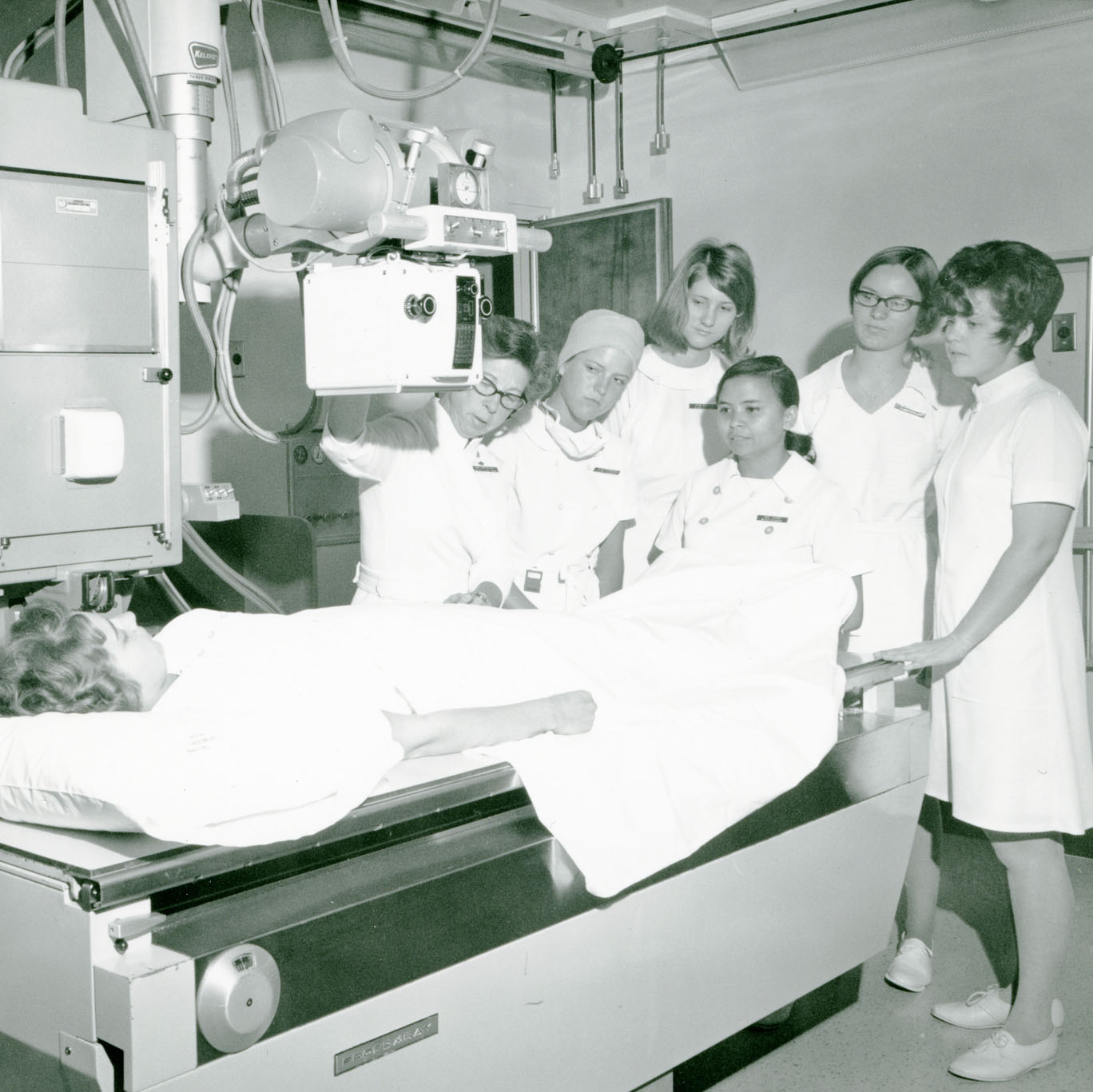 Radiology students with machinery and student "patient"