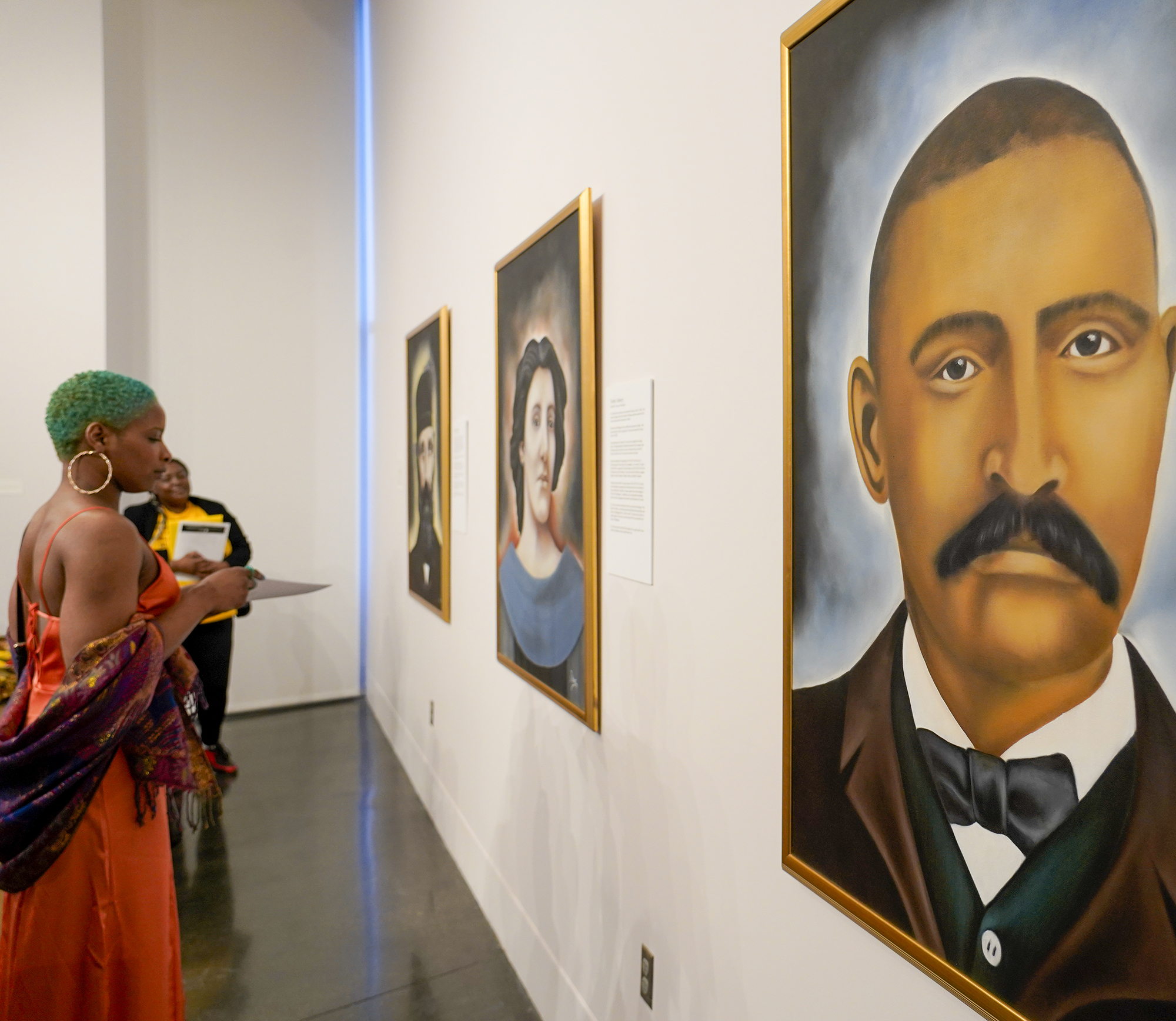 Woman looking at art in gallery