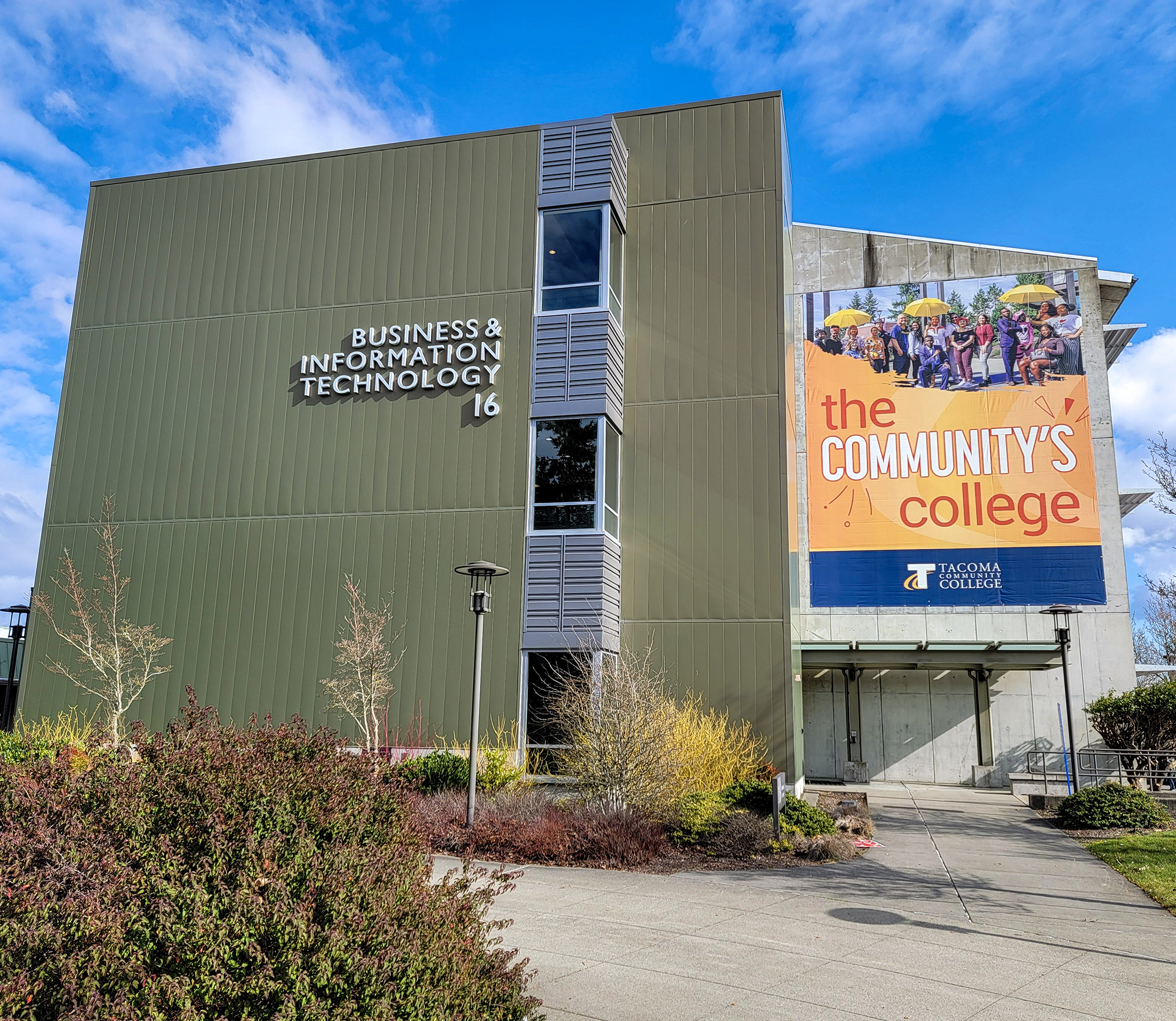 Front of Building 16 Business and Information Technology building with TCC "The Community's College" banner on it